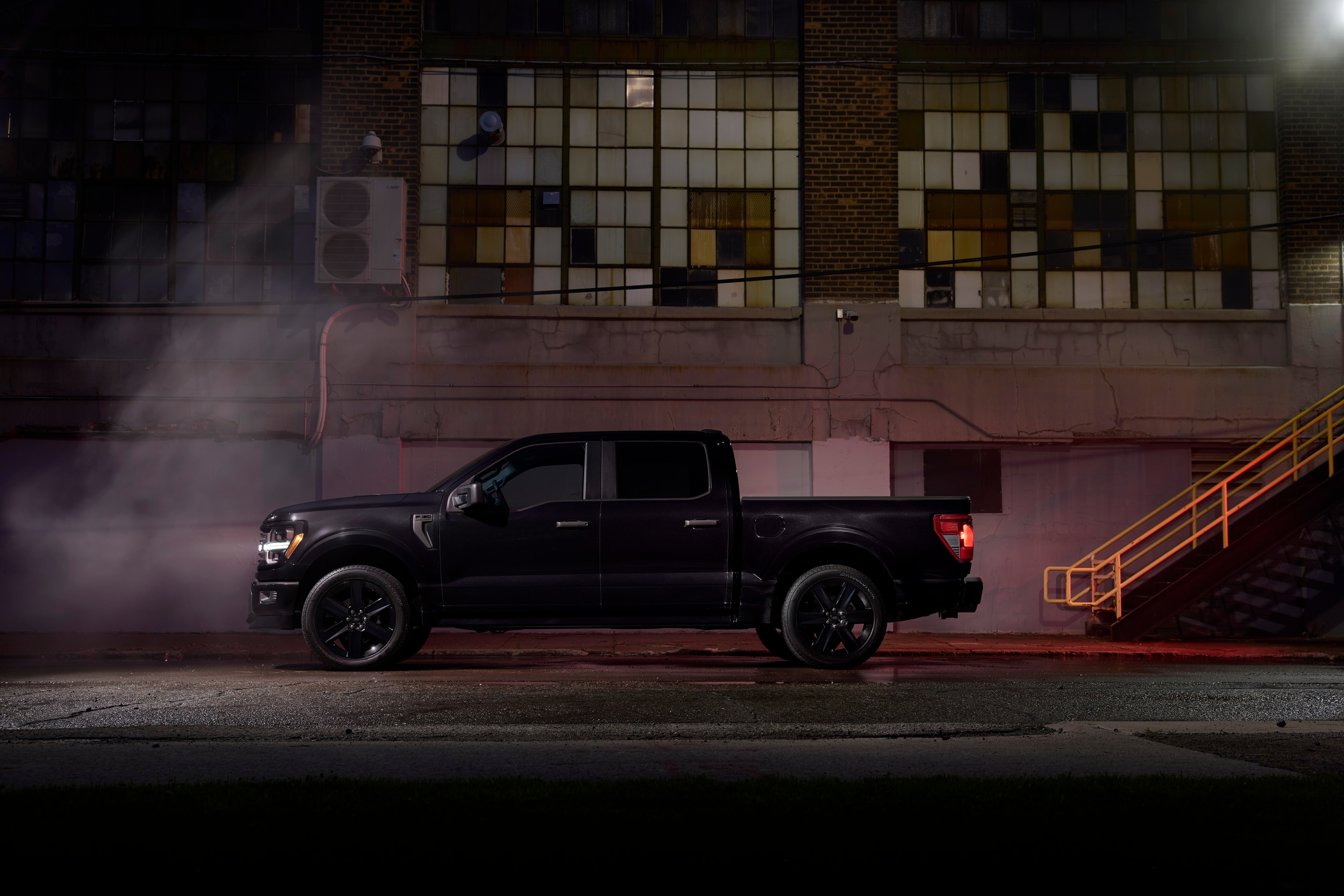 Side shot of Ford F-150 Lobo at night.